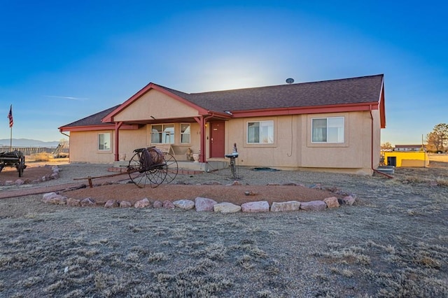 view of front of house with a shingled roof