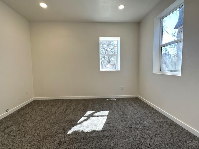 1016 E 10th St, Pueblo, CO 81001 - spare room featuring recessed lighting, baseboards, and dark colored carpet
