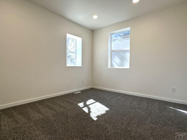 1016 E 10th St, Pueblo, CO 81001 - unfurnished room featuring recessed lighting, baseboards, and dark carpet