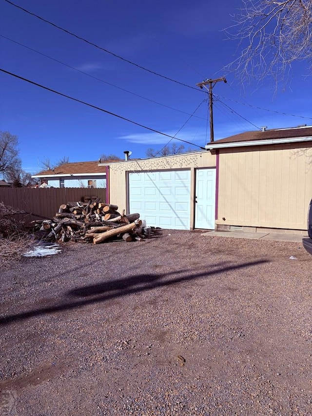 garage featuring fence