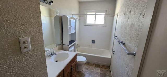 full bathroom featuring vanity, a textured wall, toilet, and shower / tub combination