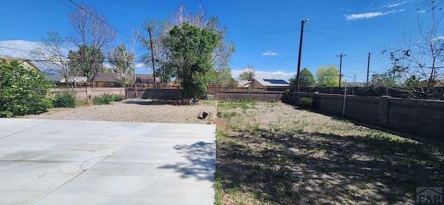 view of yard with a patio and fence