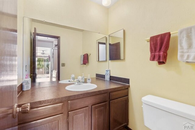 half bathroom with toilet and vanity