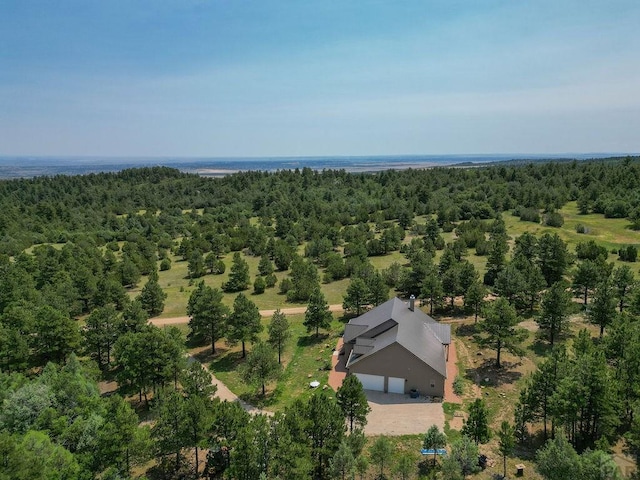 aerial view featuring a wooded view