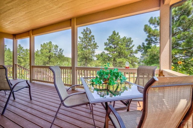 deck with outdoor dining area