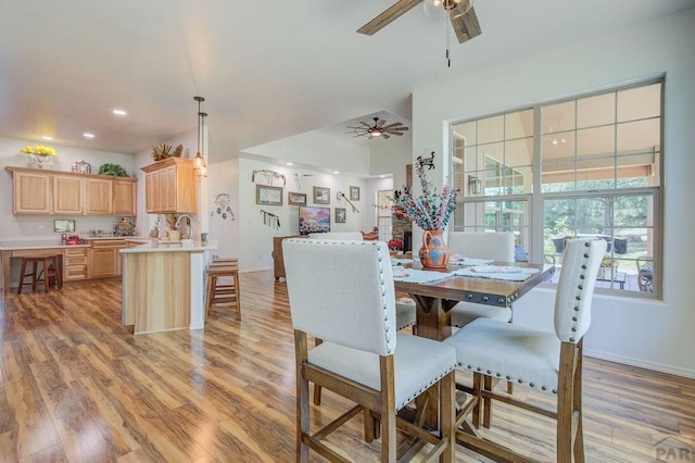 dining room featuring ceiling fan, recessed lighting, light wood-style flooring, and baseboards