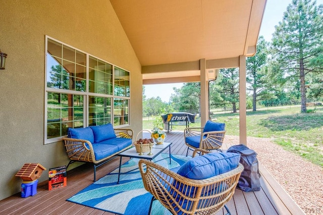 wooden terrace featuring an outdoor hangout area