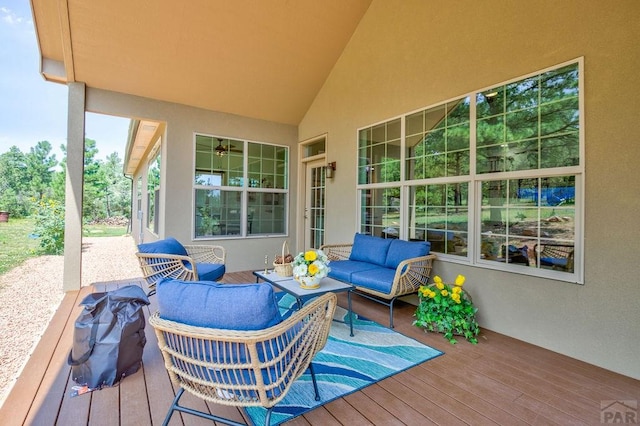 wooden terrace with an outdoor hangout area