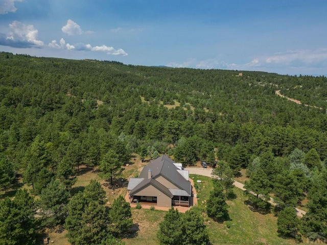 aerial view with a wooded view