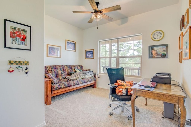 home office with carpet, a ceiling fan, and baseboards