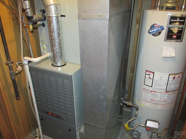 1520 Lexington Rd, Pueblo, CO 81001 - utility room with water heater and heating unit