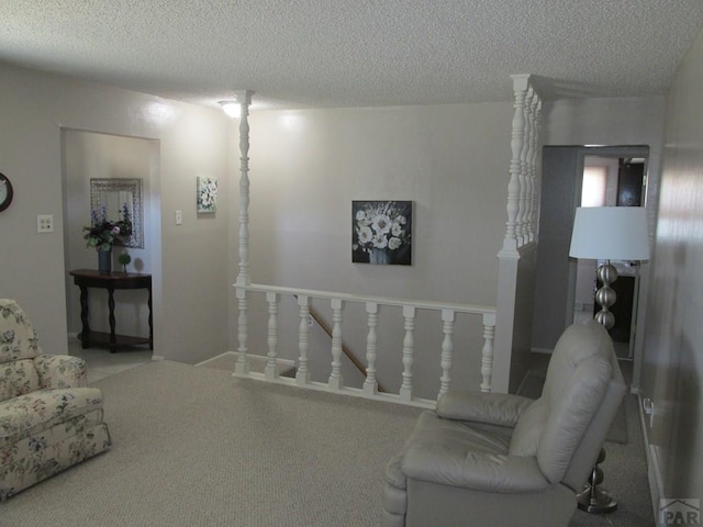 1520 Lexington Rd, Pueblo, CO 81001 - carpeted living area featuring a textured ceiling