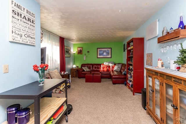 living room featuring a bar and light colored carpet