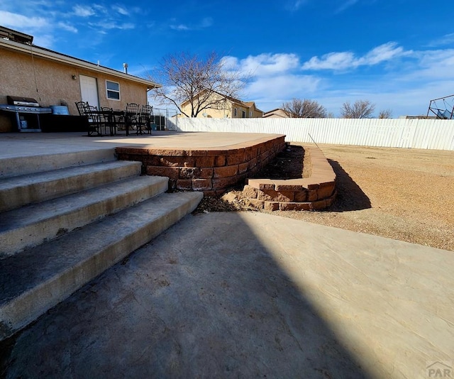 1044 S Los Charros Dr, Pueblo West, CO 81007 - view of patio featuring area for grilling and a fenced backyard