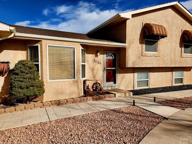 1044 S Los Charros Dr, Pueblo West, CO 81007 - view of front facade with stucco siding
