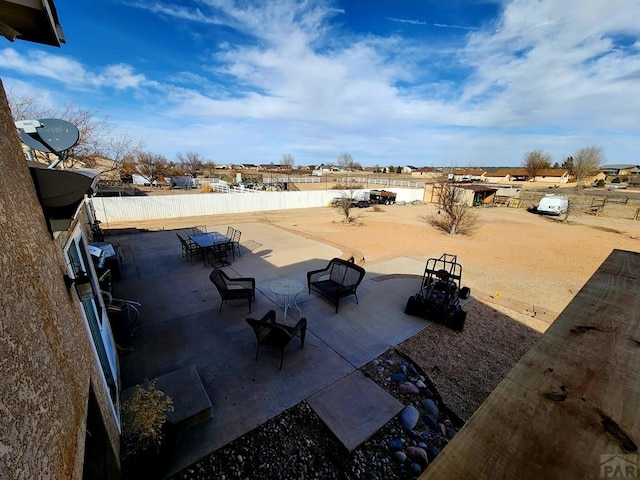 1044 S Los Charros Dr, Pueblo West, CO 81007 - view of patio featuring outdoor dining space and fence