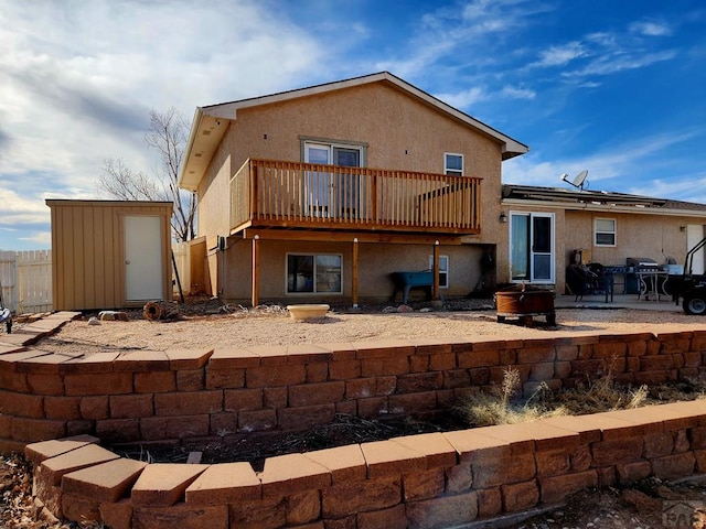 1044 S Los Charros Dr, Pueblo West, CO 81007 - back of property with an outbuilding, a patio, fence, stucco siding, and a storage shed