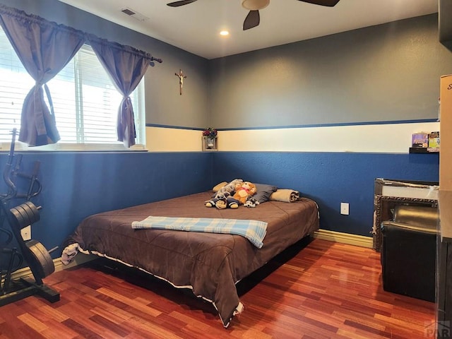 1044 S Los Charros Dr, Pueblo West, CO 81007 - bedroom featuring ceiling fan, visible vents, baseboards, and wood finished floors