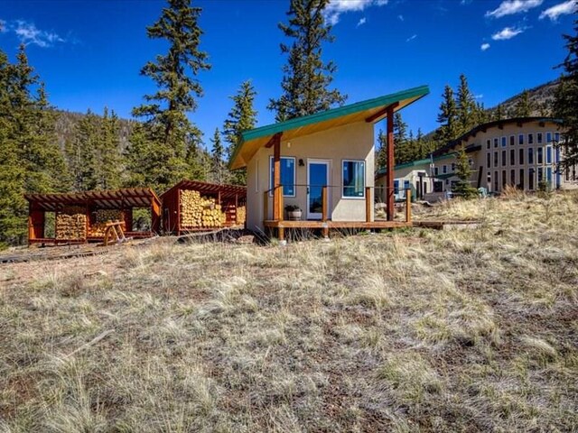 1441 Forest Rd Unit 507 1A, Creede, CO 81130 - rear view of property with a deck and stucco siding