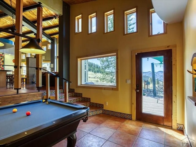 1441 Forest Rd Unit 507 1A, Creede, CO 81130 - recreation room featuring plenty of natural light, baseboards, pool table, a high ceiling, and tile patterned flooring