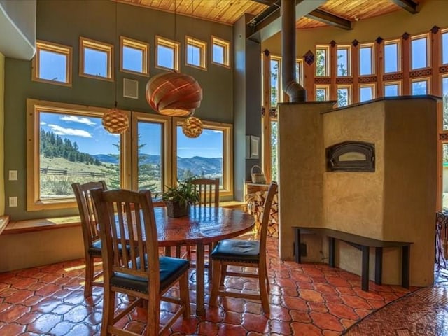 1441 Forest Rd Unit 507 1A, Creede, CO 81130 - dining space with wooden ceiling with exposed beams, healthy amount of natural light, and a towering ceiling