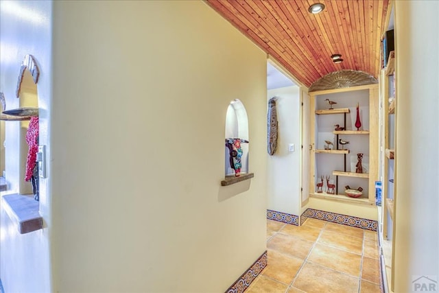 1441 Forest Rd Unit 507 1A, Creede, CO 81130 - hall featuring lofted ceiling, wooden ceiling, light tile patterned floors, and baseboards