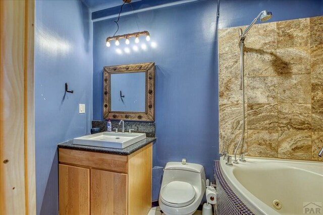 1441 Forest Rd Unit 507 1A, Creede, CO 81130 - full bathroom featuring toilet, vanity, and a combined bath / shower with jetted tub