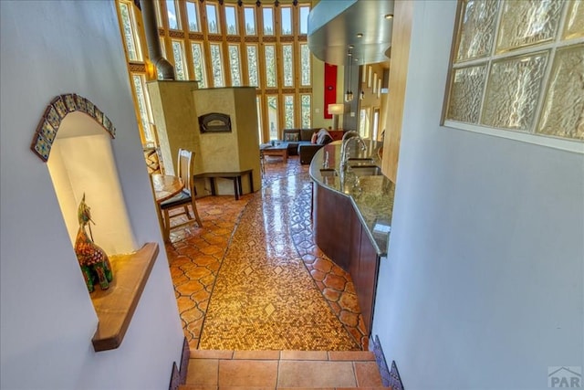 1441 Forest Rd Unit 507 1A, Creede, CO 81130 - corridor featuring a towering ceiling and tile patterned floors