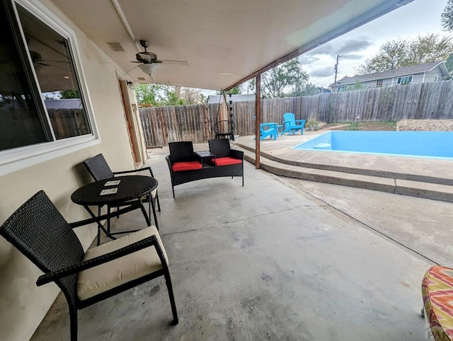 view of patio / terrace featuring a fenced backyard, a ceiling fan, and visible vents