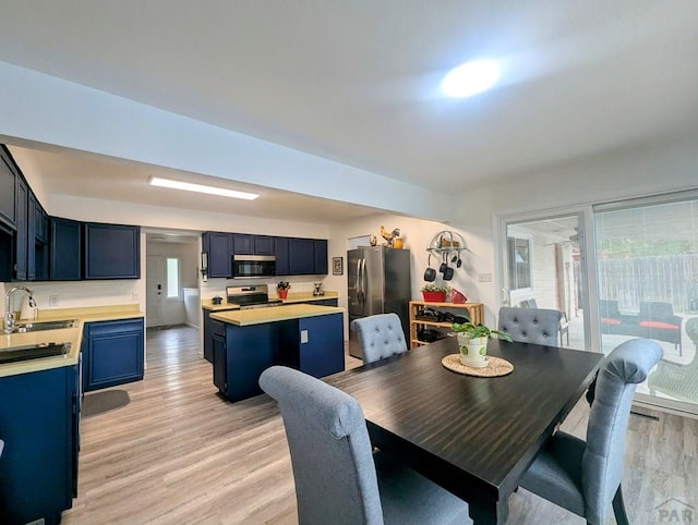 spare room with baseboards, a textured ceiling, visible vents, and wood finished floors