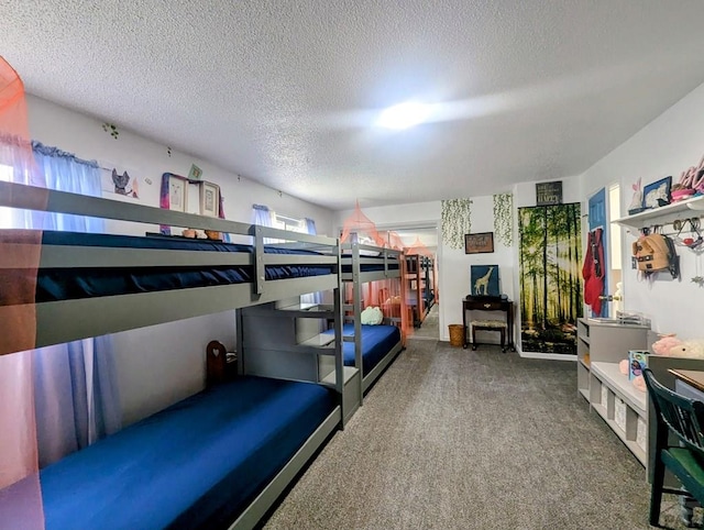 bedroom with carpet flooring and a textured ceiling