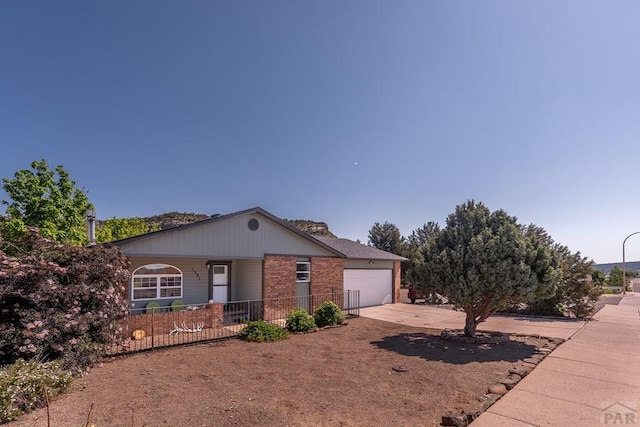1501 Stonewall, Trinidad, CO 81082 - ranch-style house featuring driveway, a garage, covered porch, and brick siding