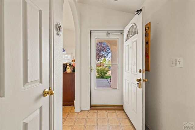 entryway featuring baseboards