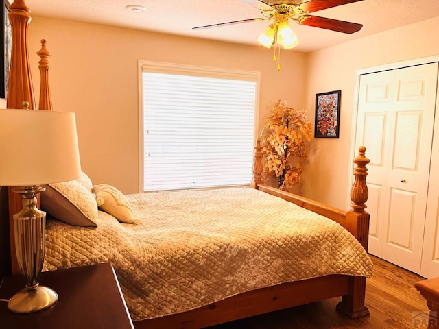 bedroom featuring a ceiling fan and wood finished floors
