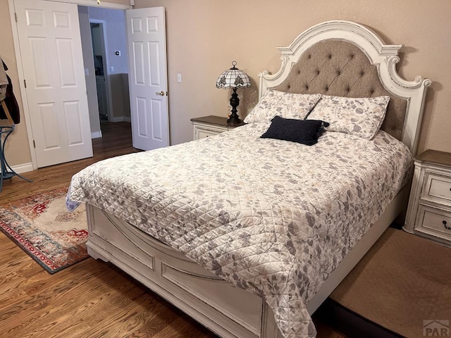 bedroom featuring wood finished floors