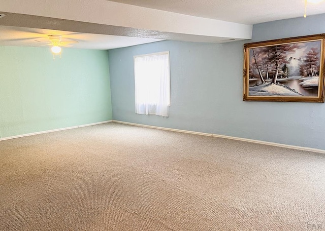 1619 Weatherby Ln, Pueblo, CO 81008 - spare room featuring baseboards, a ceiling fan, and carpet