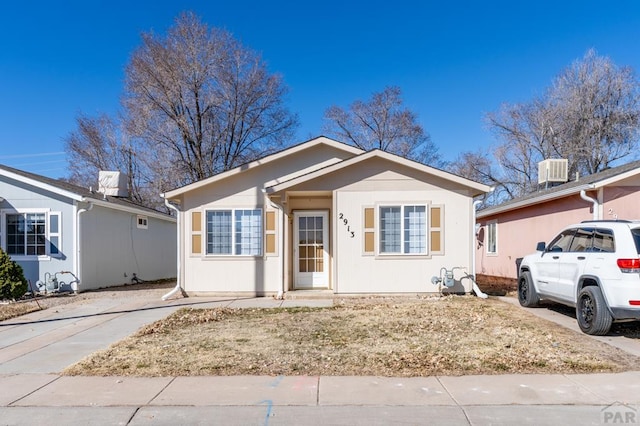 bungalow-style home featuring central AC unit