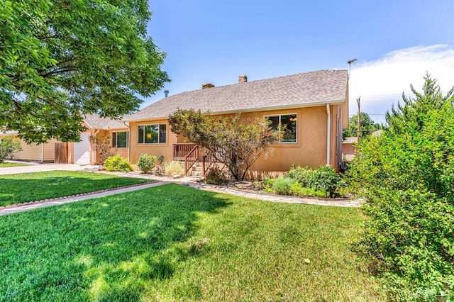 1215 Greenwood Ave, Canon City, CO 81212 - single story home featuring a chimney, a front lawn, driveway, stucco siding, and an attached garage