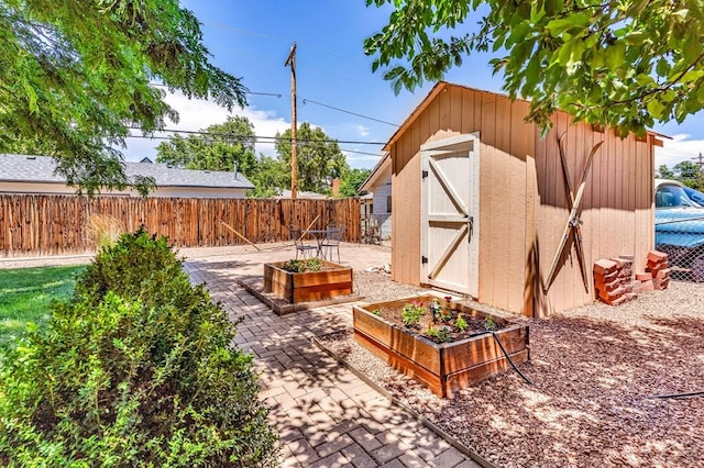 1215 Greenwood Ave, Canon City, CO 81212 - fenced backyard featuring a garden and a storage shed