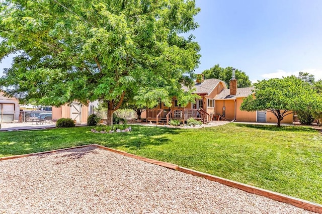 1215 Greenwood Ave, Canon City, CO 81212 - view of grassy yard featuring a storage unit