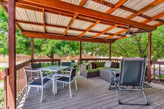 1215 Greenwood Ave, Canon City, CO 81212 - wooden deck with a fenced backyard, outdoor dining space, an outdoor hangout area, and ceiling fan