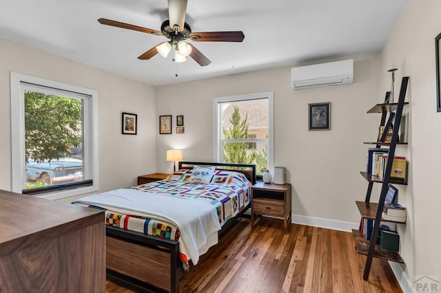 1215 Greenwood Ave, Canon City, CO 81212 - bedroom featuring a wall mounted air conditioner, wood finished floors, and ceiling fan