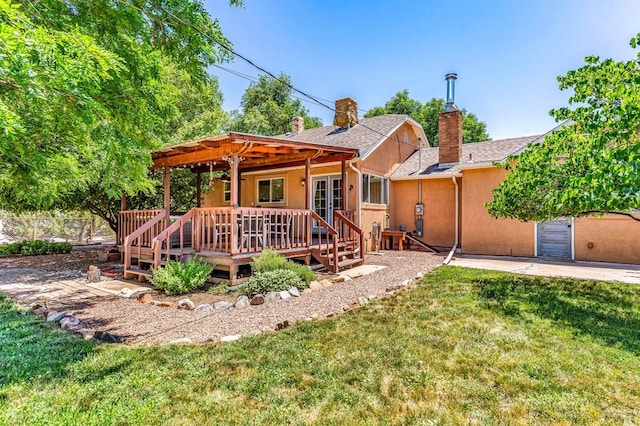 1215 Greenwood Ave, Canon City, CO 81212 - back of house with a deck, a chimney, a pergola, and stucco siding