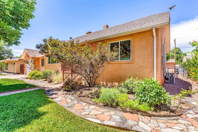 1215 Greenwood Ave, Canon City, CO 81212 - view of front facade with stucco siding and a chimney