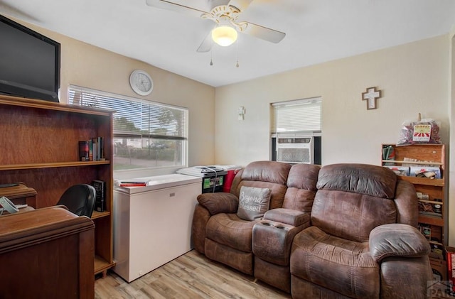 2615 Lambert Ave, Pueblo, CO 81003 - living area with a ceiling fan, cooling unit, and light wood-style floors