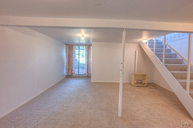 2000 Comanche Dr, Walsenburg, CO 81089 - basement with carpet flooring, baseboards, and stairway
