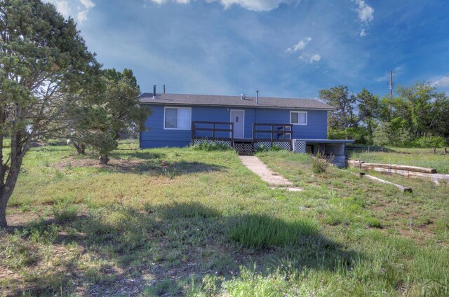 2000 Comanche Dr, Walsenburg, CO 81089 - rear view of house with a wooden deck