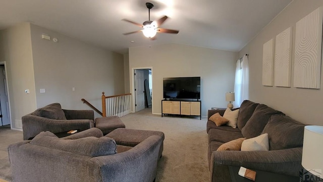 living room with light colored carpet, ceiling fan, and vaulted ceiling