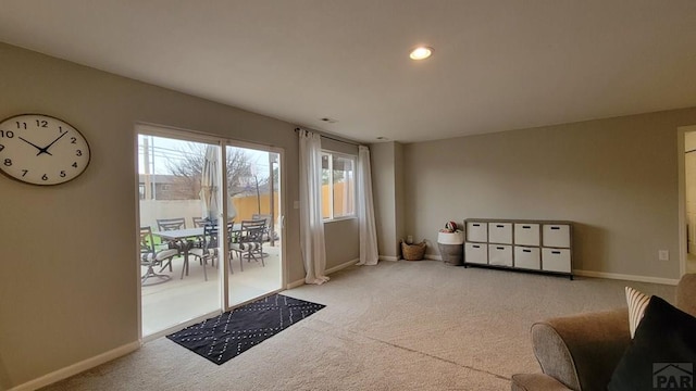 doorway to outside featuring carpet flooring, recessed lighting, and baseboards