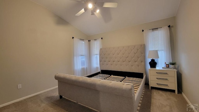 carpeted bedroom with baseboards, ceiling fan, and vaulted ceiling